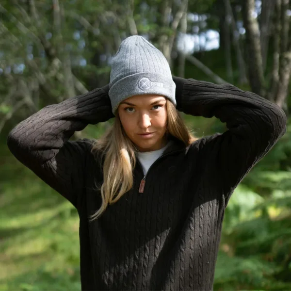 An image of a female model wearing an Xtreme Grey Beanie.